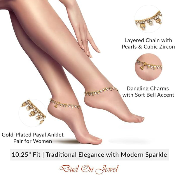 Close-up of traditional payal bells and shimmering cubic zircon on a gold-tone foot chain.
