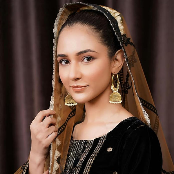 Close-up of the secure infinity hoop closure on a pair of bronze-tone pearl-adorned earrings.
