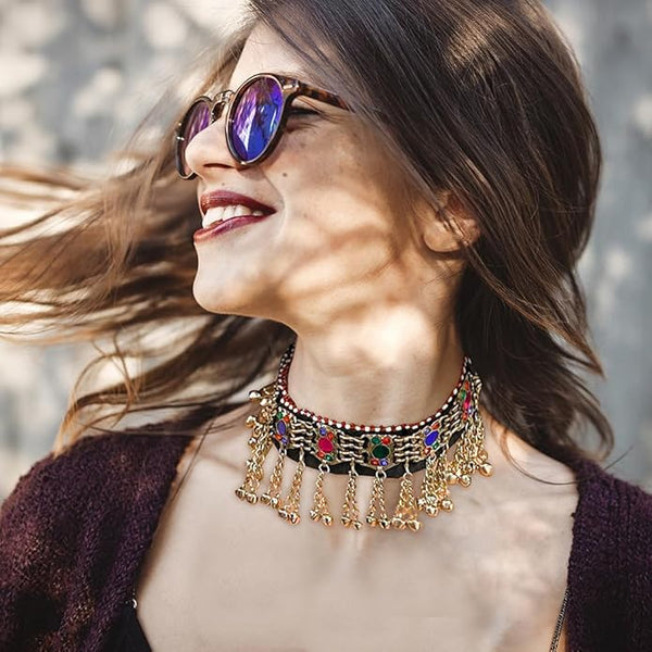 Bohemian festival choker with engraved metal coins and vibrant glass stone accents.

