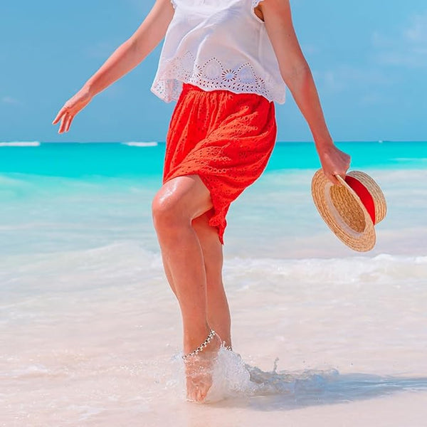Close-up of the easy-to-use S-hook fastening on a silver-plated jhanjar anklet with black round charms.
