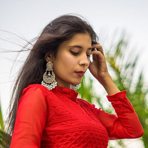 Handcrafted Pakistani bridal earrings with intricate filigree and sparkling zircon accents.
