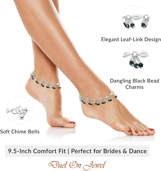 Handcrafted South Asian foot jewelry with traditional bells and a 0.75-inch wide ornate leaf-link chain.
