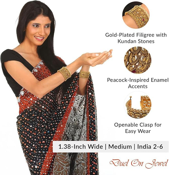 Model wearing wide gold-plated kundan kada bangles with a red and black saree; cuff style kangan.

