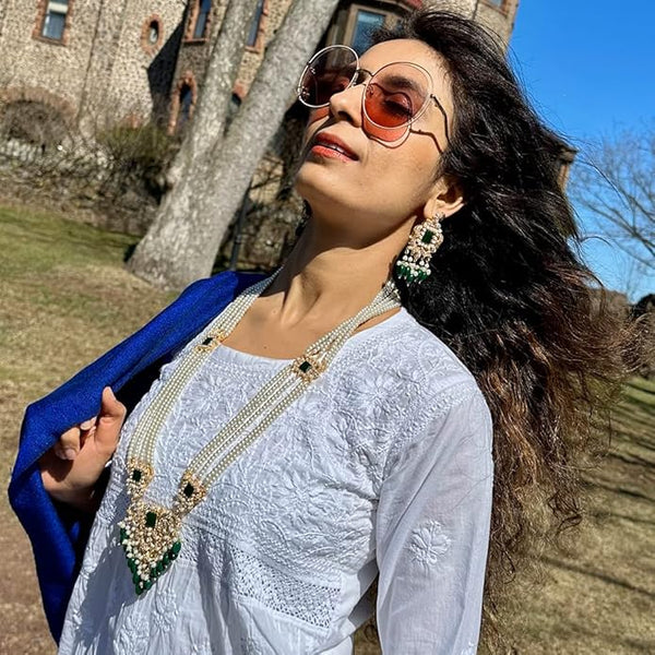 Handcrafted Pakistani bridal necklace set with freshwater pearls and gold-plated pendant.
