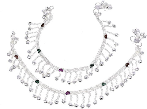 Model wearing silver-tone wave anklets featuring dangling beads and traditional jingle bells.
