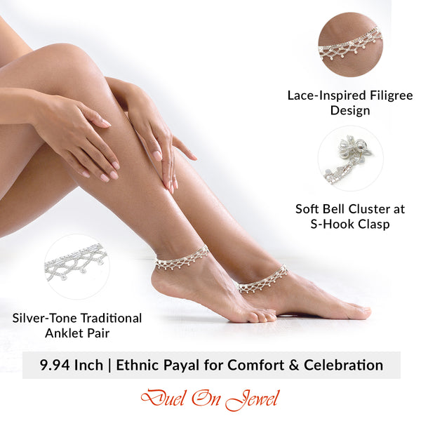 Handcrafted South Asian foot jewelry with layered filigree metalwork and melodic bell charms.