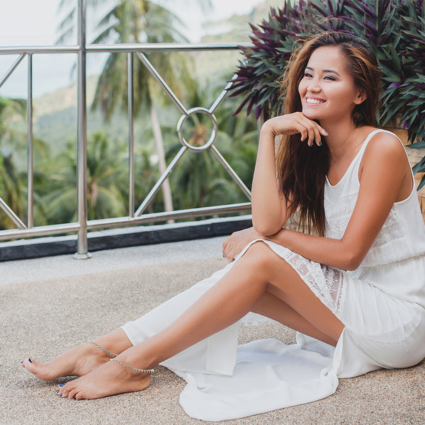 Close-up of the easy-to-use S-hook fastening on a silver teardrop rhinestone anklet for women.
