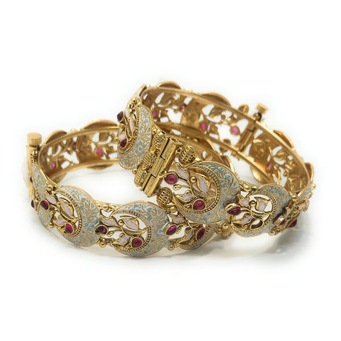 Close-up of gold-tone Polki crescent moon Meenakari bangle set with a hijab outfit.
