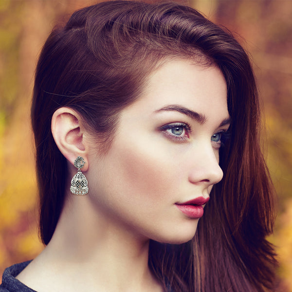 Heritage lattice silverwork earrings styled with traditional Indian attire for cultural celebrations
