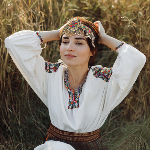 Vintage-style Afghan tribal headband featuring a central medallion and intricate chain details.
